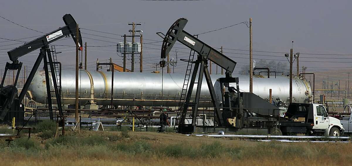 **FILE** In this June 26, 2008 file photo, oil well pump jacks of Chevron Corp. are shown in the hills in Coalinga, Calif. Flush with cash from huge profits, Big Oil could be preparing to get bigger. (AP Photo/Gary Kazanjian, File)