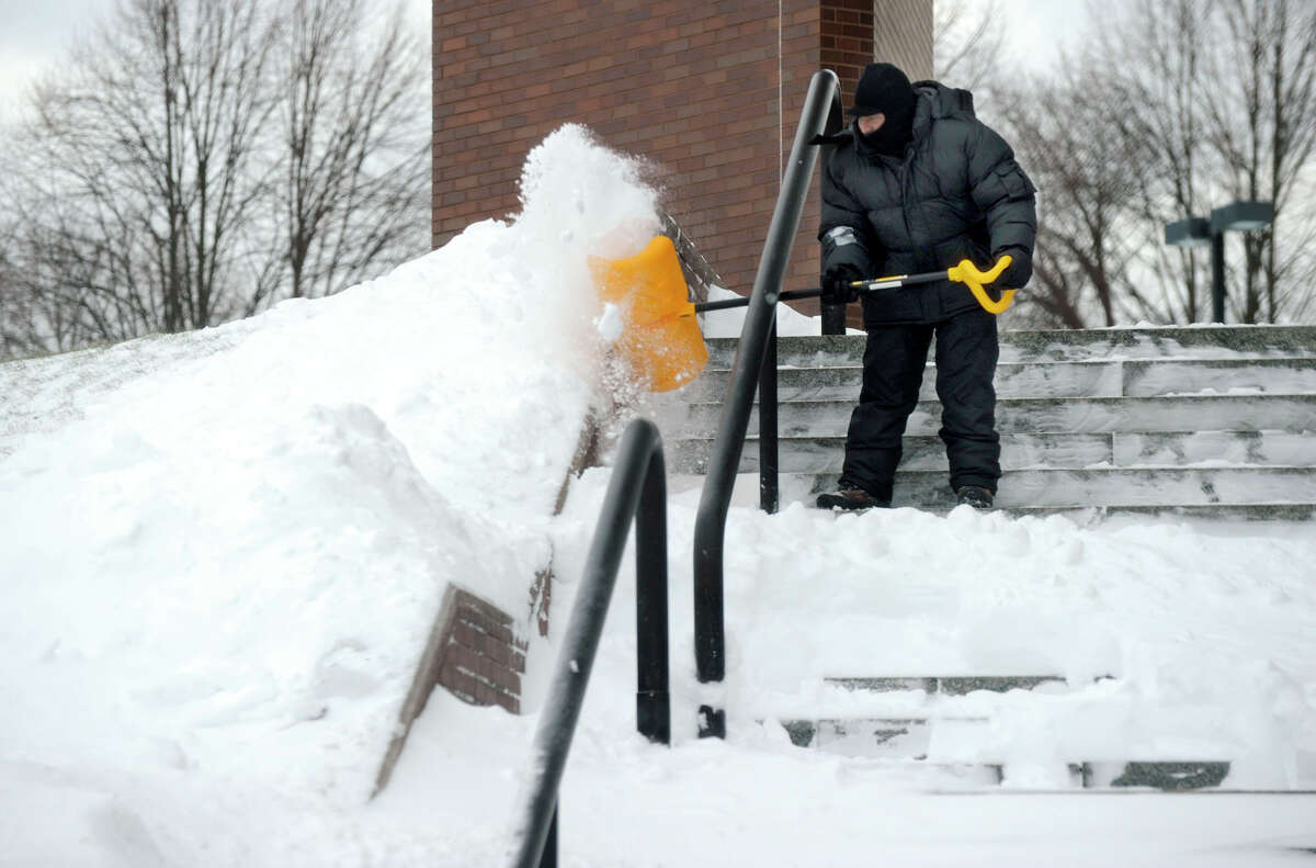 The steps of the Danbury Superior Court is shovelled Saturday morning, Feb. 9, 2013, after a heavy snow fall.