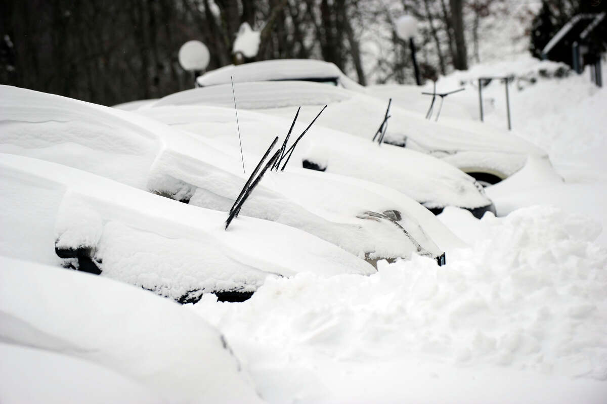 In a scene repeated all over the area this morning, cars are buried in snow at the Sheperd Hill Condominiums in Danbury early Saturday morning, Feb. 9, 2013. A blizzard Friday into Saturday dumped almost two feet of snow.
