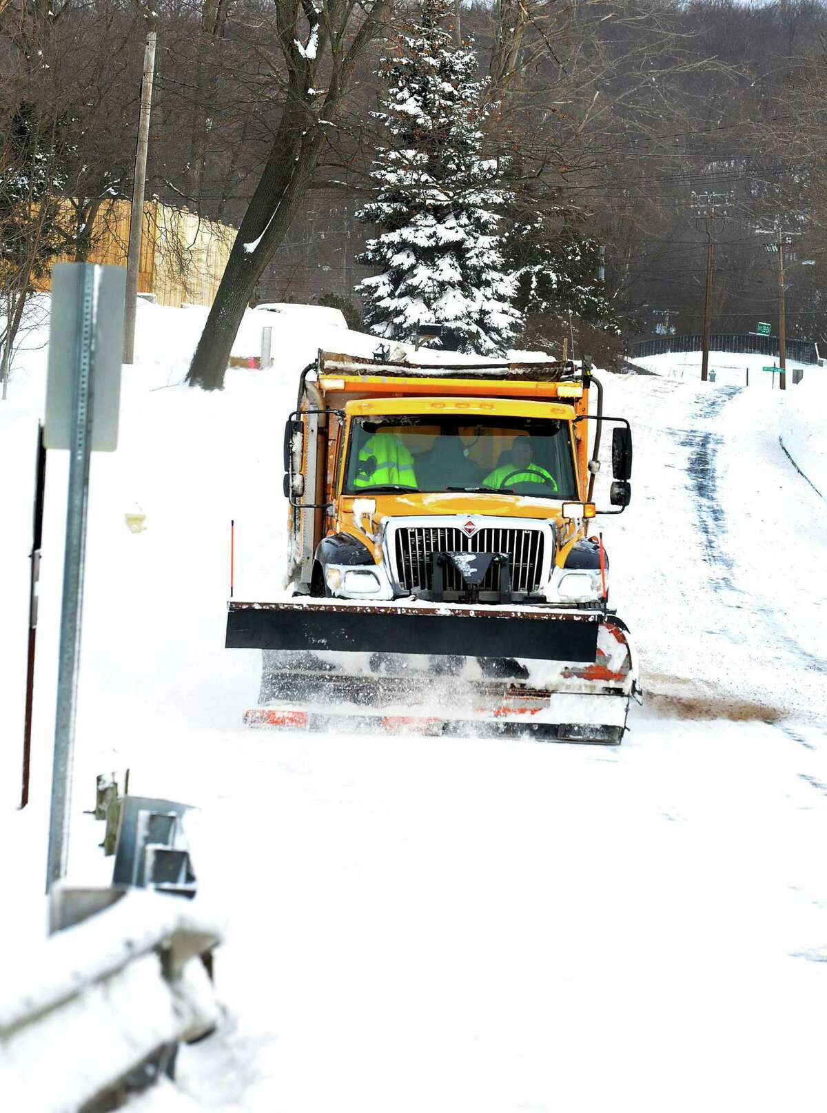 A City plow truck clears Kenosia Avenue in Danbury Friday, Feb. 8, 2013.