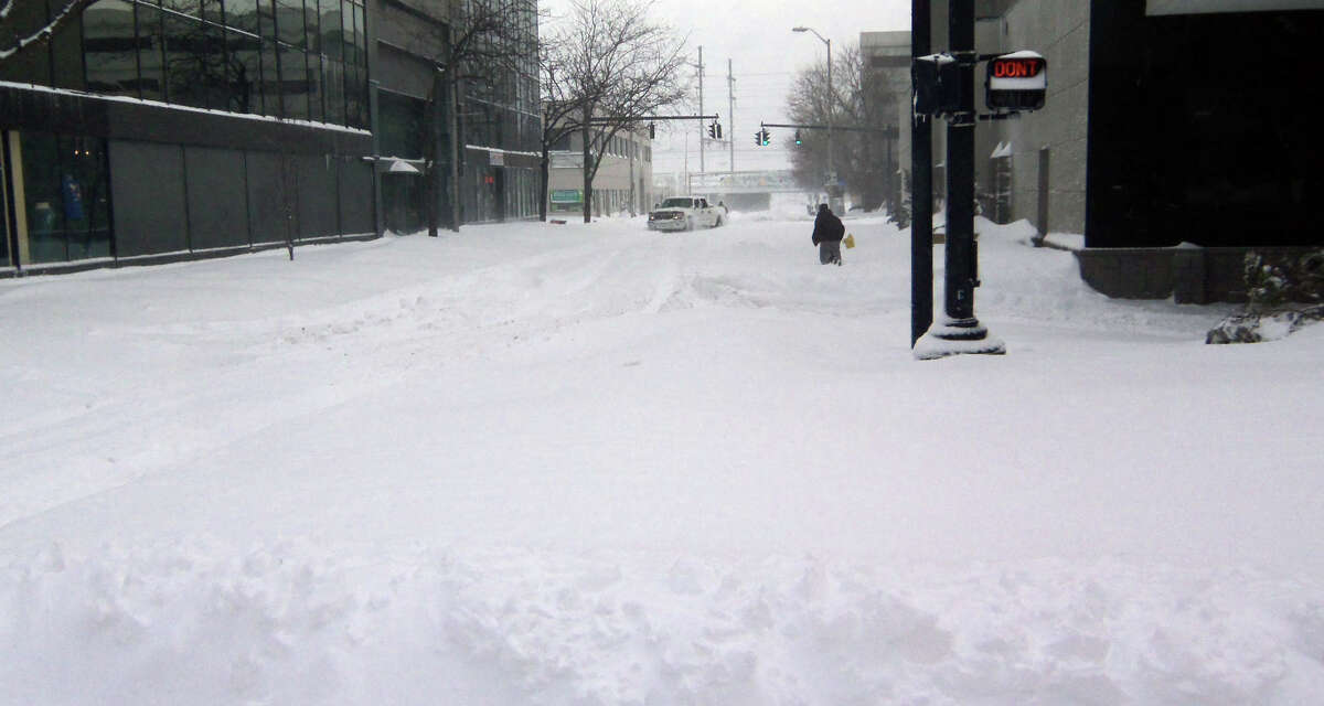 Looking east along Fairfield Avenue from Main Street in downtown Bridgeport Saturday morning. The four-wheel-drive pickup truck in the background was stuck in a drift.