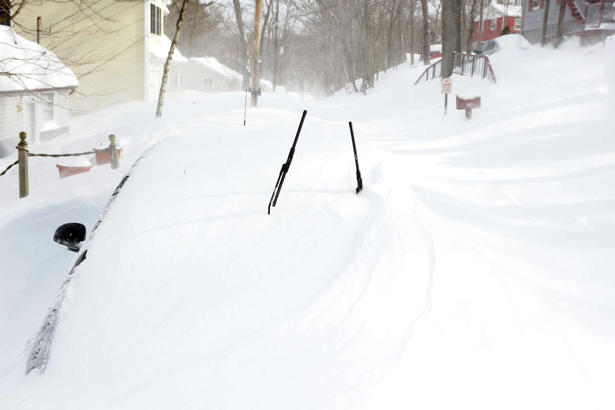A car covered by a snow drift on Circle Dr., in Stratford, Conn., Feb. 9th, 2013.