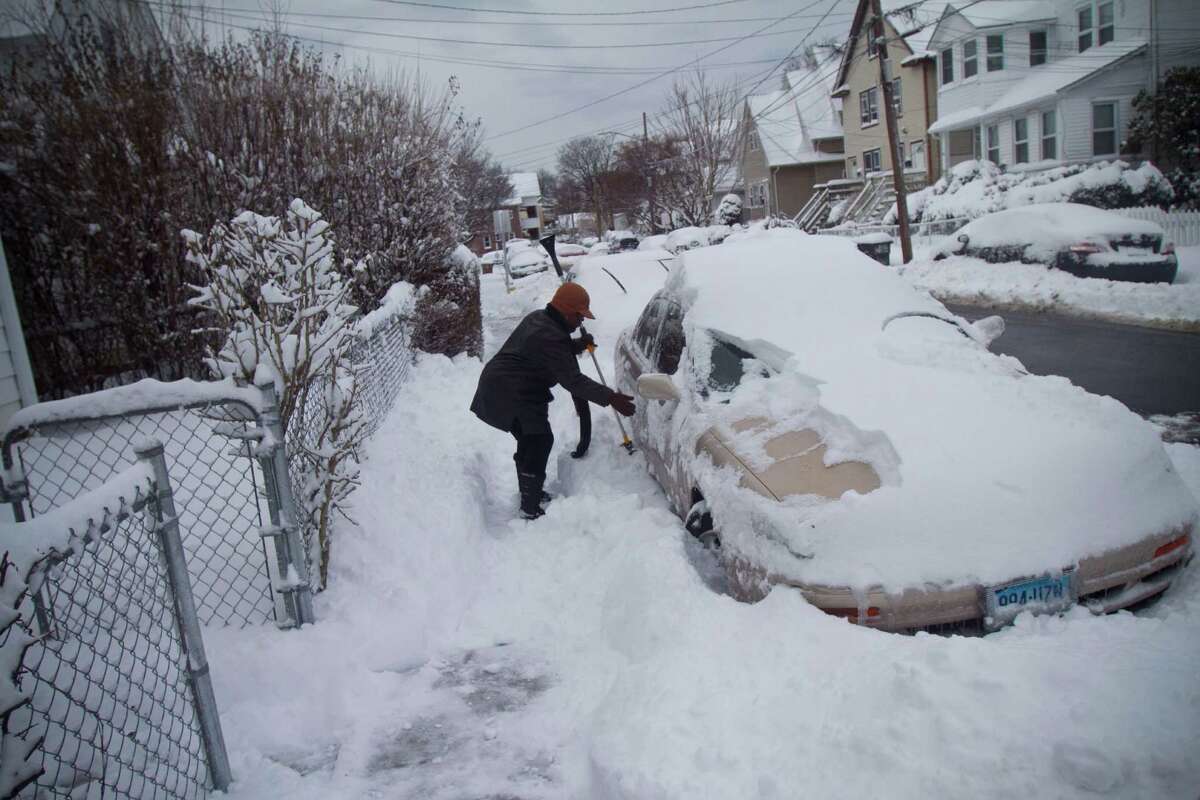 Mary Pryce, a resident of Stamford's West Side digs out from the blizzard on Saturday, Feb. 9, 2013.