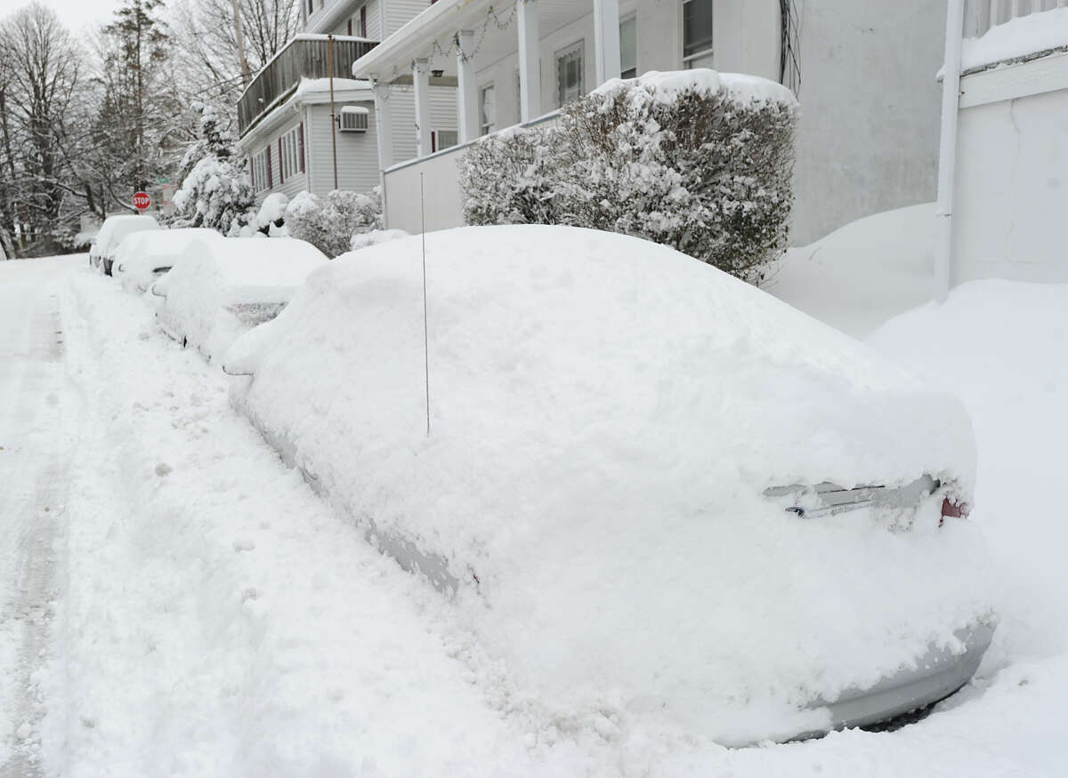 Vehicles covered in snow on South Watrer Street in Byram, during the aftermath of the blizzard that hit Greenwich, Conn., Saturday morning, Feb. 9, 2013.