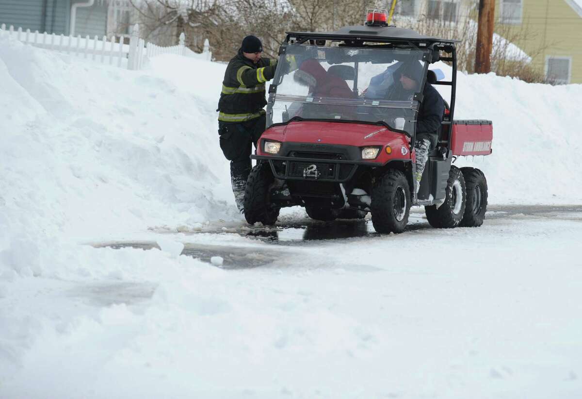 The Derby Storm Rescue truck shuttles an employee to work at Griffin Hospital in Derby, Conn. as residents remain strandedl Saturday, Feb. 9, 2013 following a severe blizzard that dumped up to three feet of snow across the state.