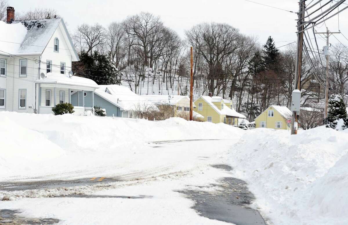 Residents in Derby, Conn. face massive snow removal Saturday, Feb. 9, 2013 following a severe blizzard that dumped up to three feet of snow across the state.