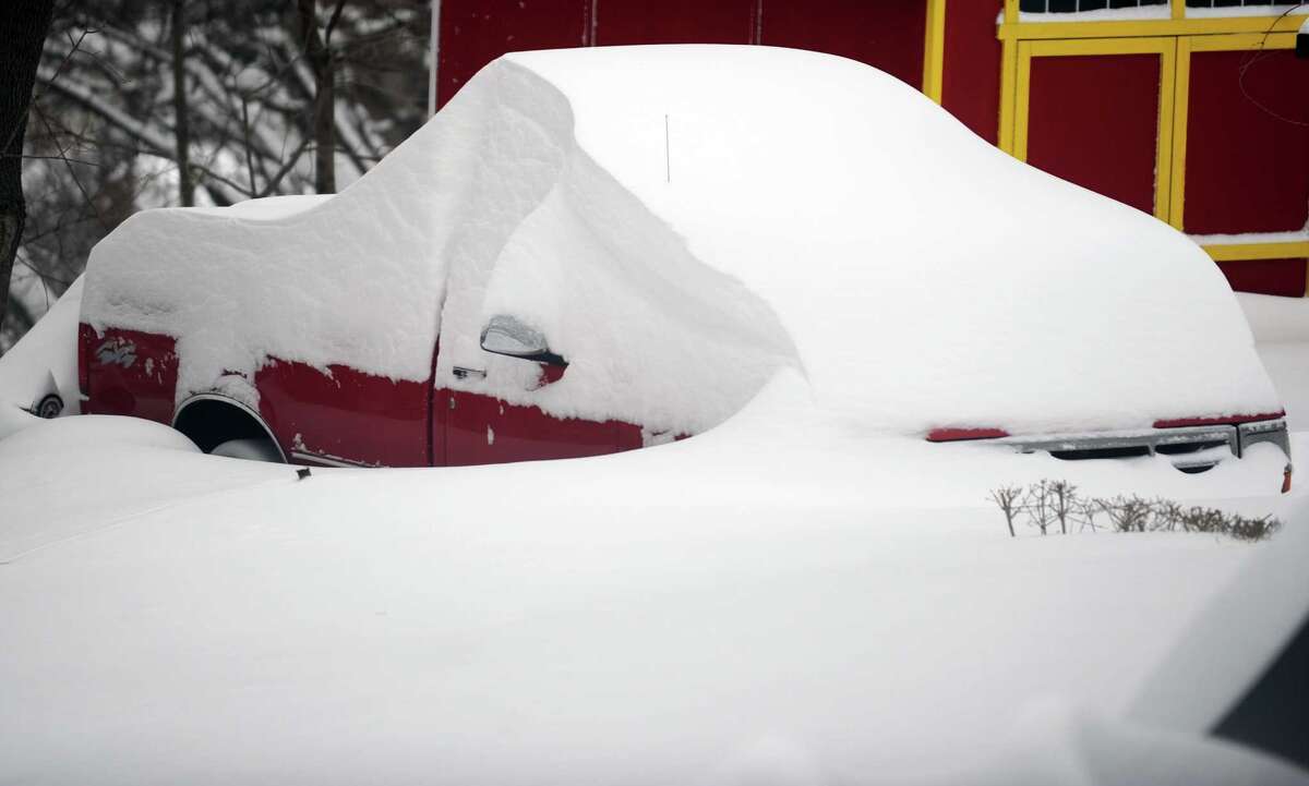 Residents in Derby, Conn. face massive snow removal Saturday, Feb. 9, 2013 following a severe blizzard that dumped up to three feet of snow across the state.