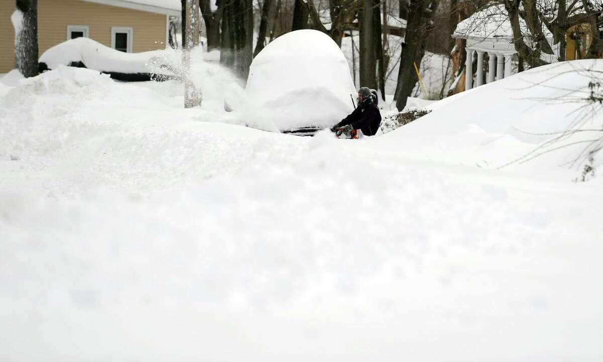 Residents in Derby, Conn. face massive snow removal Saturday, Feb. 9, 2013 following a severe blizzard that dumped up to three feet of snow across the state.