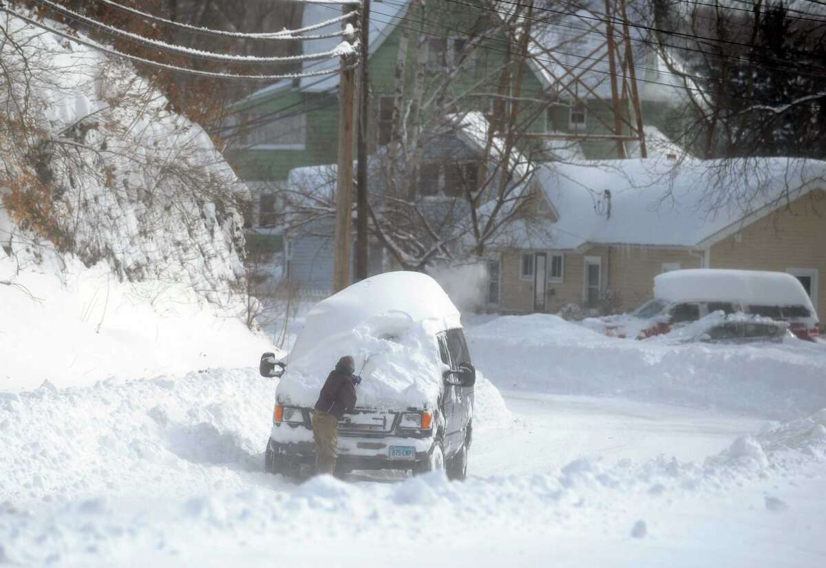 Residents in Derby, Conn. face massive snow removal Saturday, Feb. 9, 2013 following a severe blizzard that dumped up to three feet of snow across the state.