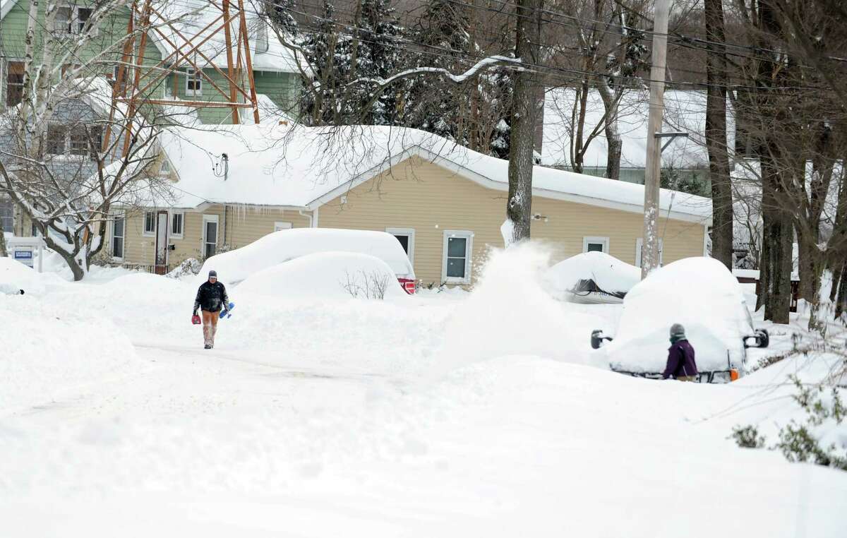 Residents in Derby, Conn. face massive snow removal Saturday, Feb. 9, 2013 following a severe blizzard that dumped up to three feet of snow across the state.