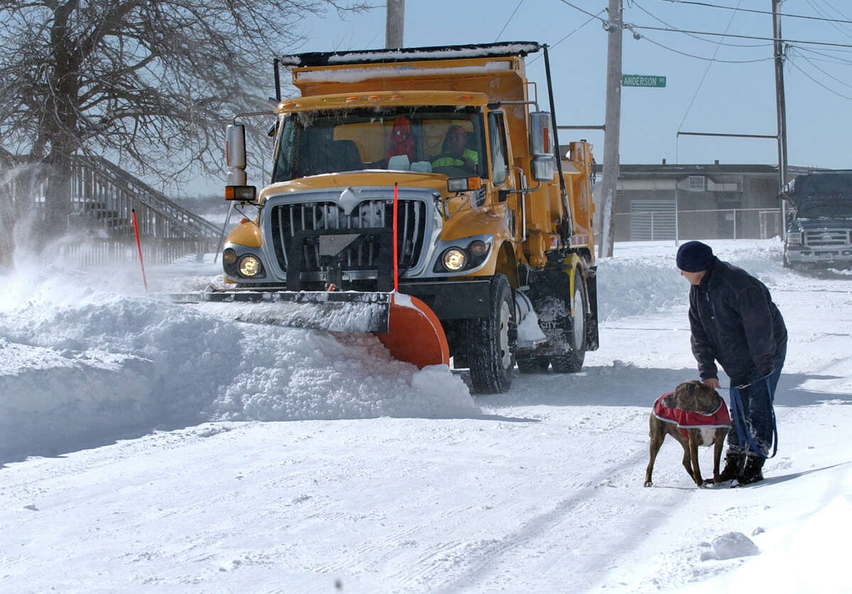 A snow plow works its way along Beach Street after a blizzard pounded the region in West Haven, Conn. on Saturday February 9, 2013. Side streets were still impassable and had not been plowed yet as of Saturda afternoon.