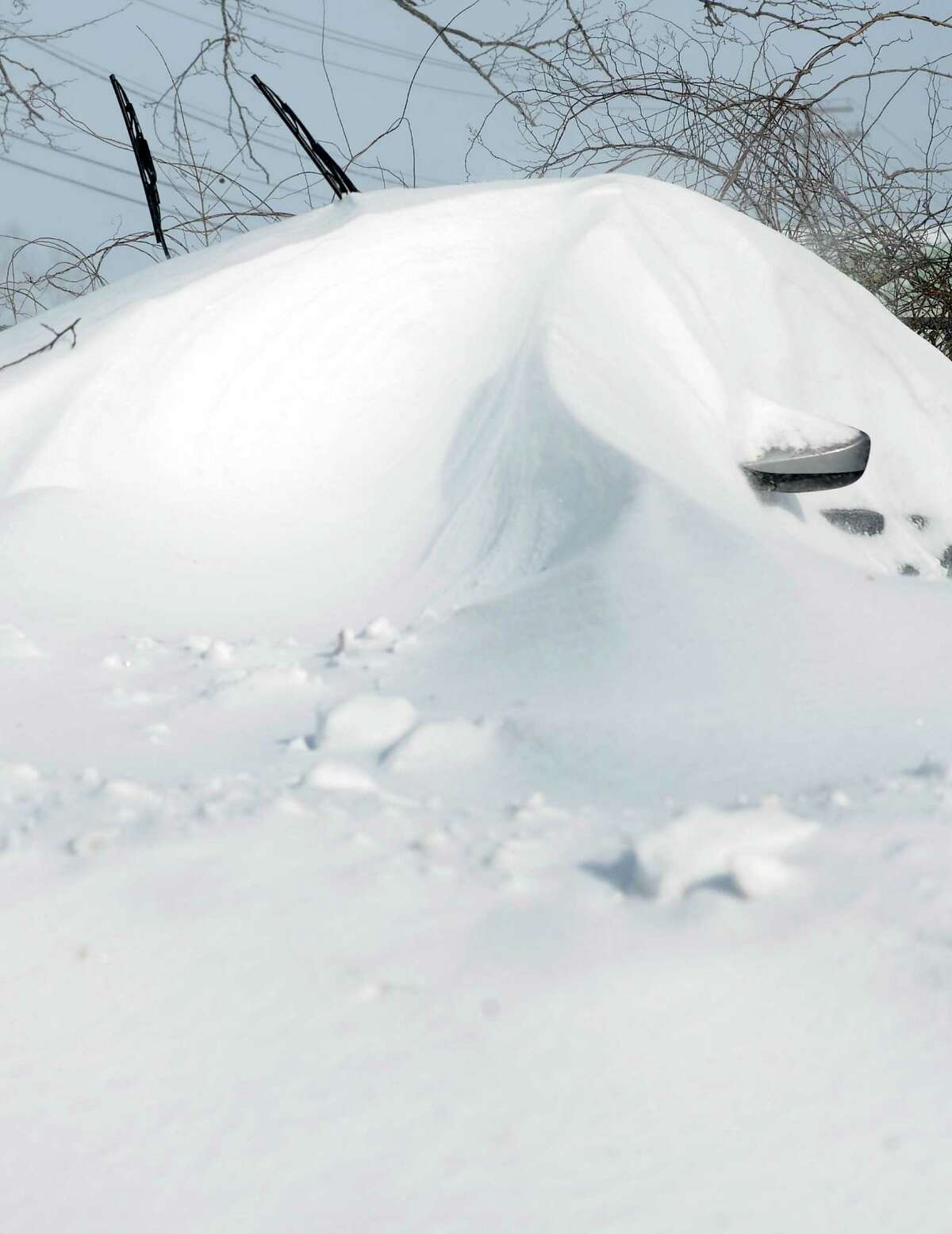 Cars were buried under snowdrifts in Fairfield, Conn. on Saturday, Feb. 9, 2013. Southwestern Connecticut was hit by a howling blizzard that dumped over two feet of snow on the area.