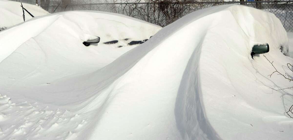 Cars were buried under snowdrifts in Fairfield, Conn. on Saturday, Feb. 9, 2013. Southwestern Connecticut was hit by a howling blizzard that dumped over two feet of snow on the area.
