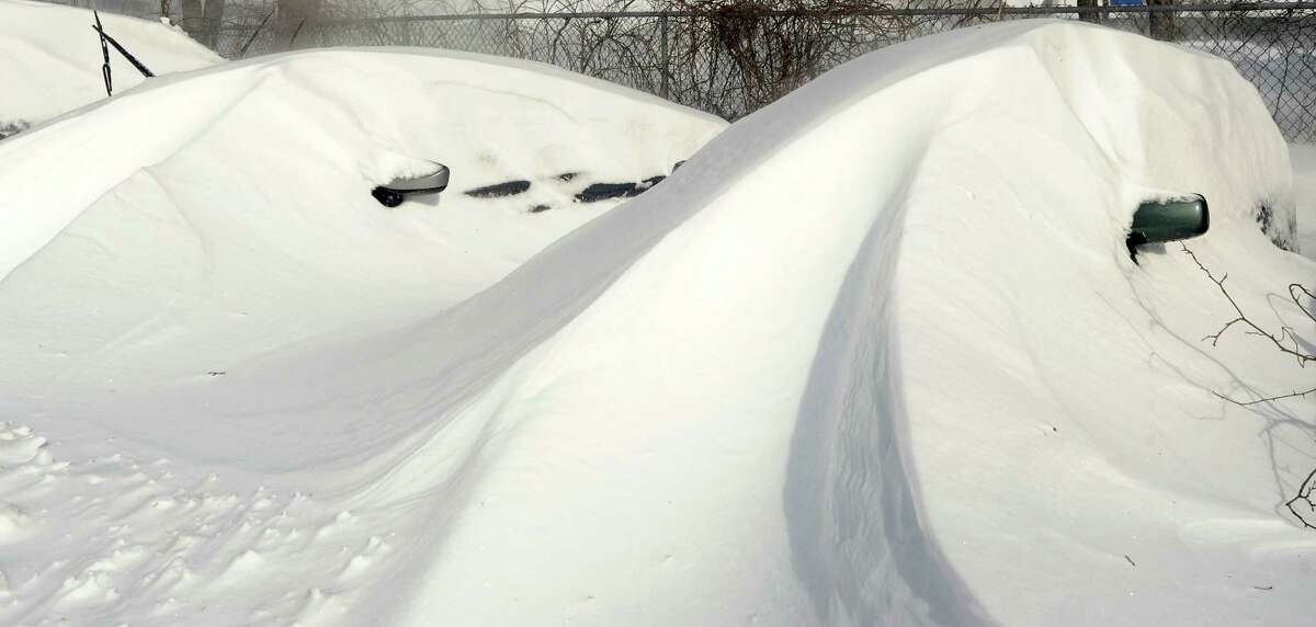 Cars were buried under snowdrifts in Fairfield, Conn. on Saturday, Feb. 9, 2013. Southwestern Connecticut was hit by a howling blizzard that dumped over two feet of snow on the area.