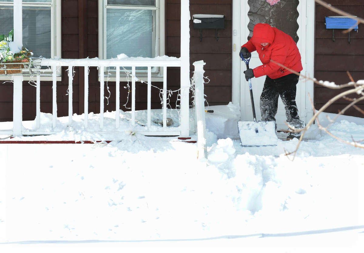Lou Petrillo digs out in front of his house after a blizzard pounded the region in West Haven, Conn. on Saturday February 9, 2013.