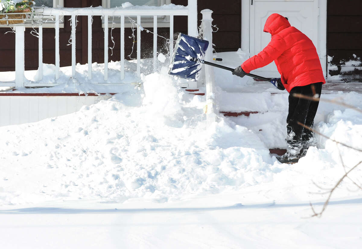 Lou Petrillo digs out in front of his house after a blizzard pounded the region in West Haven, Conn. on Saturday February 9, 2013.