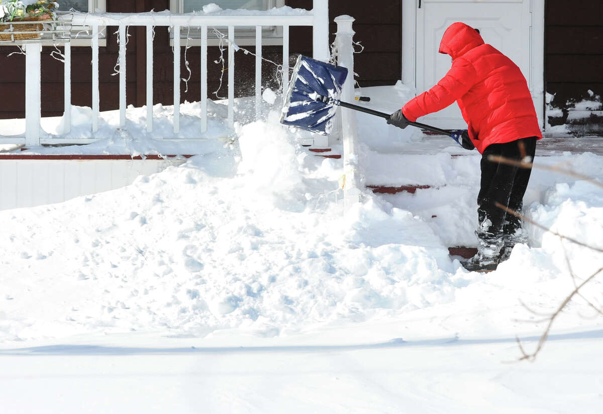 Lou Petrillo digs out in front of his house after a blizzard pounded the region in West Haven, Conn. on Saturday February 9, 2013.