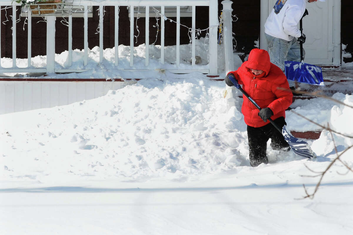 Lou Petrillo digs out in front of his house after a blizzard pounded the region in West Haven, Conn. on Saturday February 9, 2013.