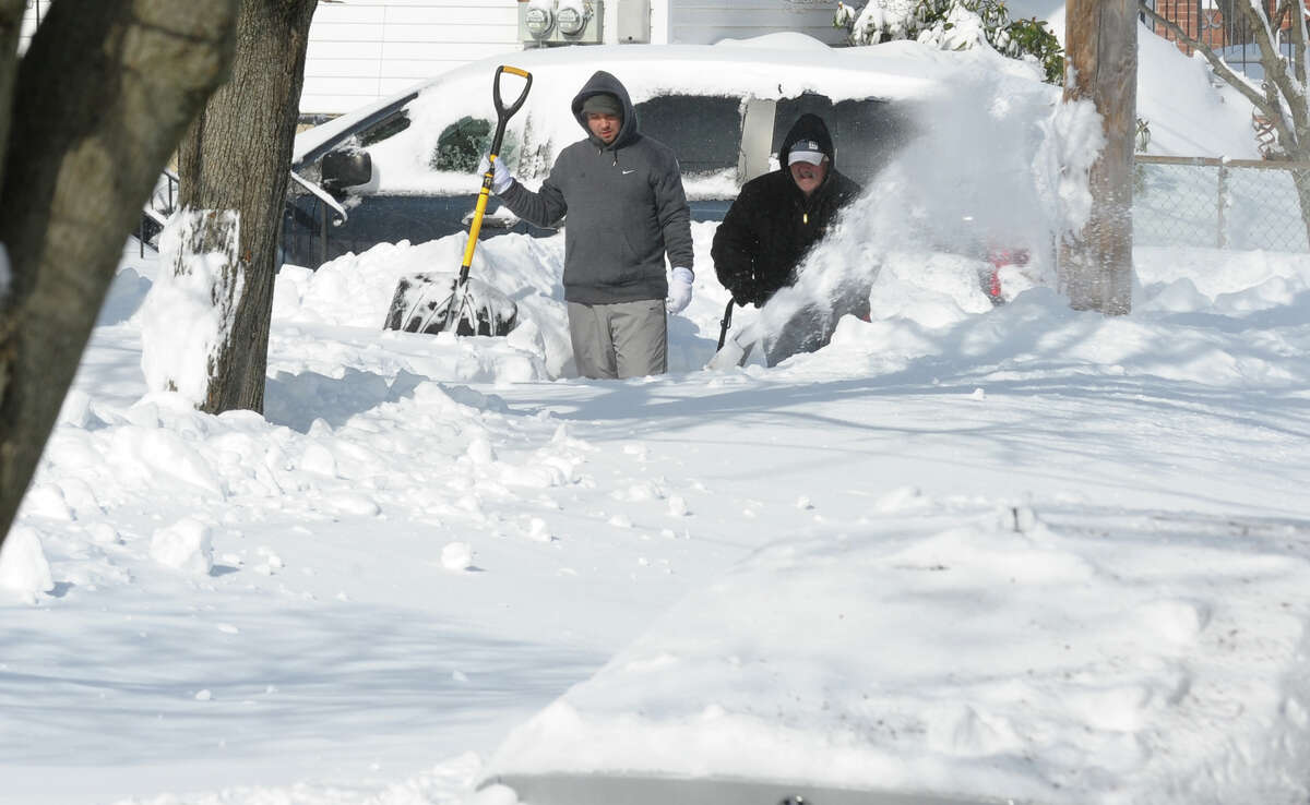 Residents dig out with shovels and snowblowers after a blizzard pounded the region in West Haven, Conn. on Saturday February 9, 2013.