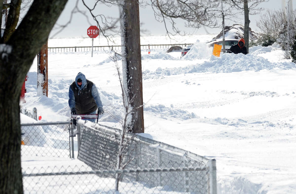 Residents dig out with shovels and snowblowers after a blizzard pounded the region in West Haven, Conn. on Saturday February 9, 2013.