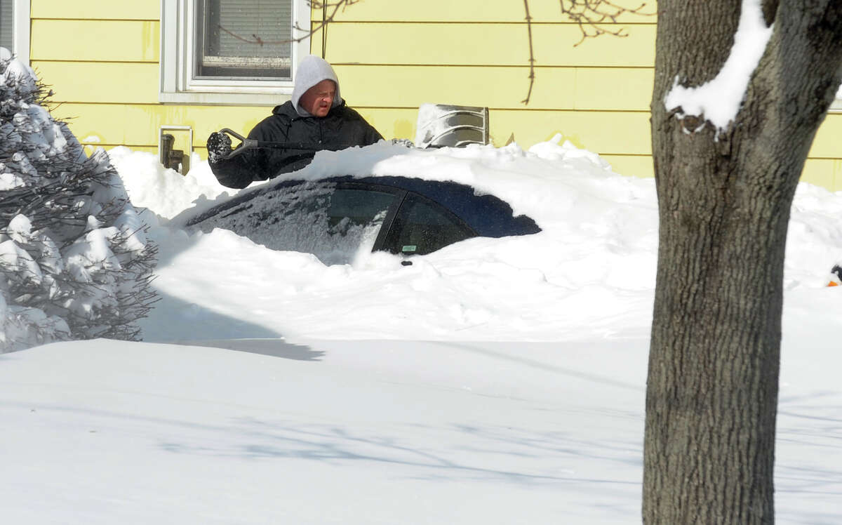 Residents dig out with shovels and snowblowers after a blizzard pounded the region in West Haven, Conn. on Saturday February 9, 2013.