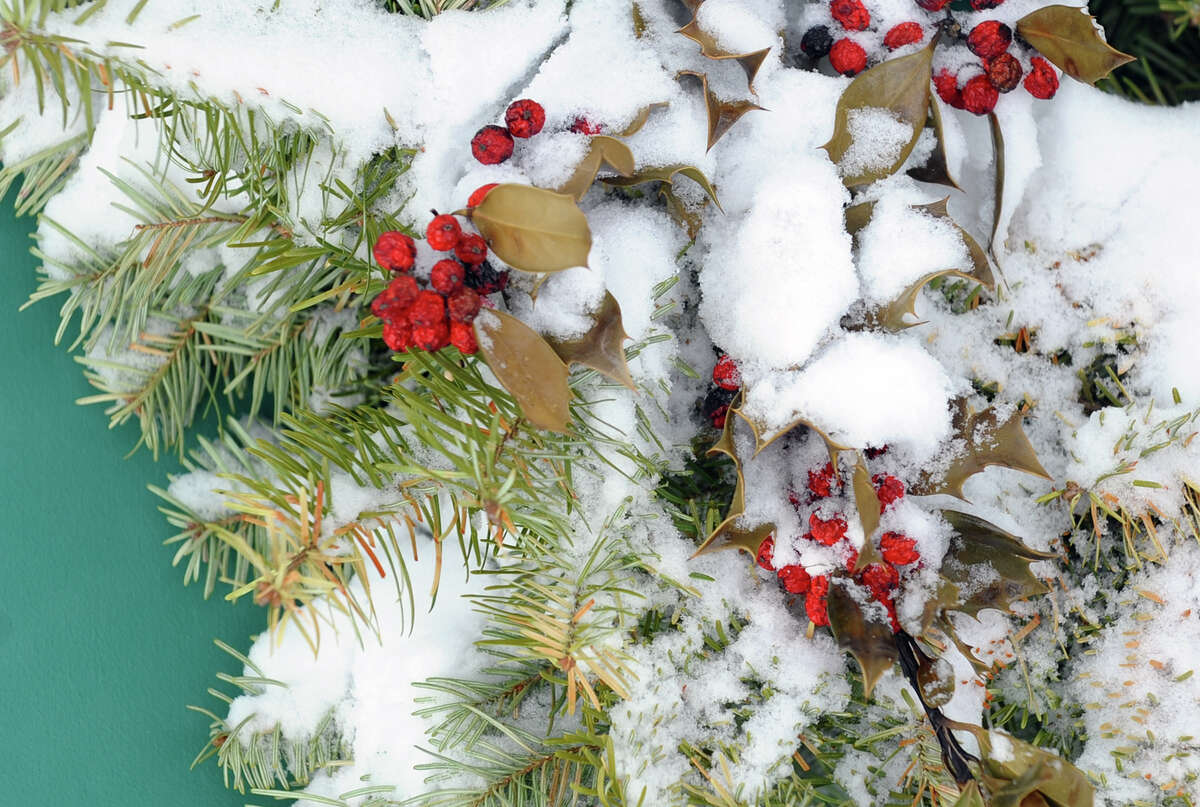 Snow covers a door wreath after a blizzard pounded the region in West Haven, Conn. on Saturday February 9, 2013.