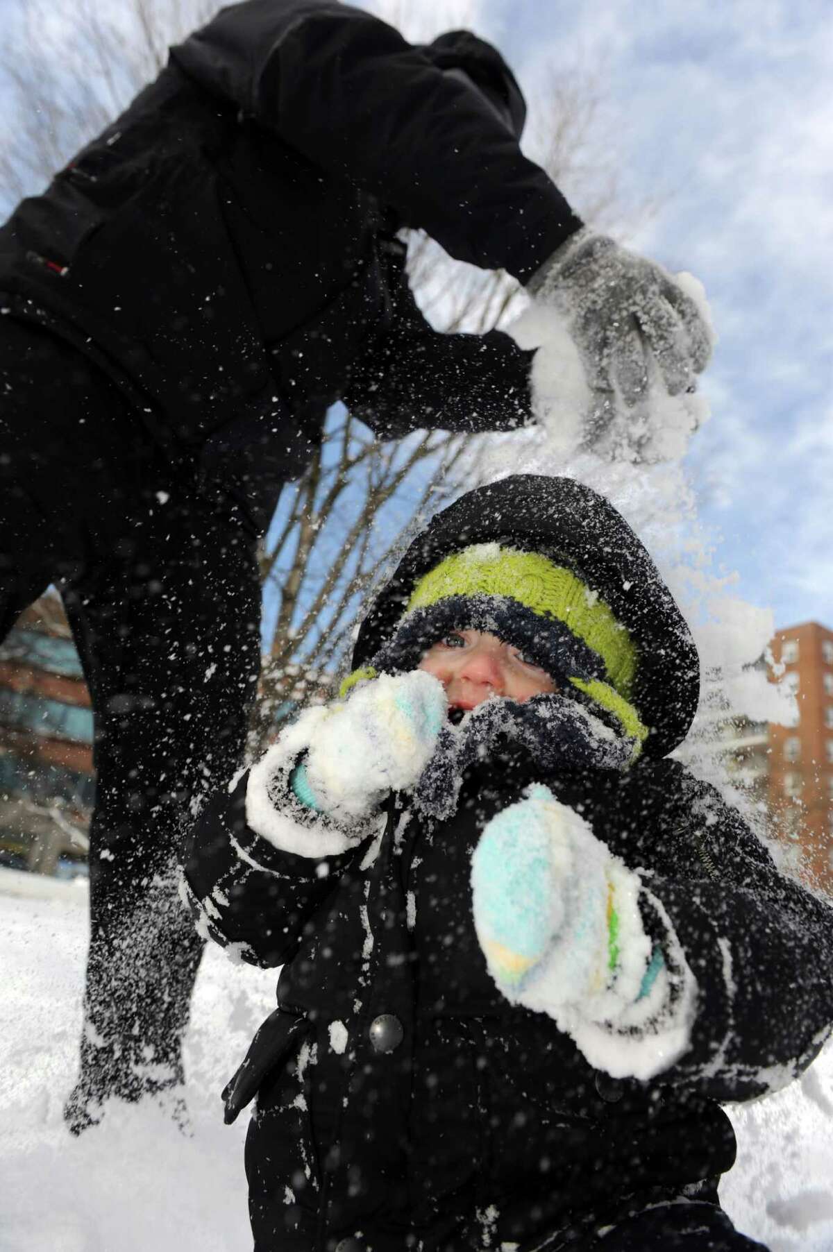 Warren Bradley plays with his son, Henry, 2, in Latham Park in Stamford, Conn., on Saturday, February 9, 2013.