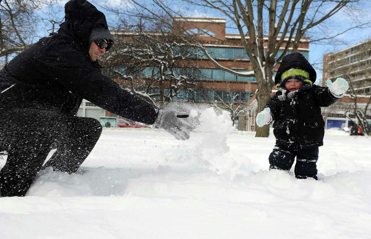 Warren Bradley plays with his son, Henry, 2, in Latham Park in Stamford, Conn., on Saturday, February 9, 2013.