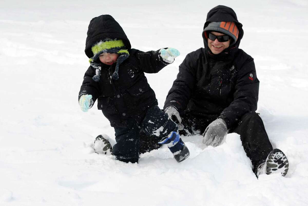 Warren Bradley plays with his son, Henry, 2, in Latham Park in Stamford, Conn., on Saturday, February 9, 2013.