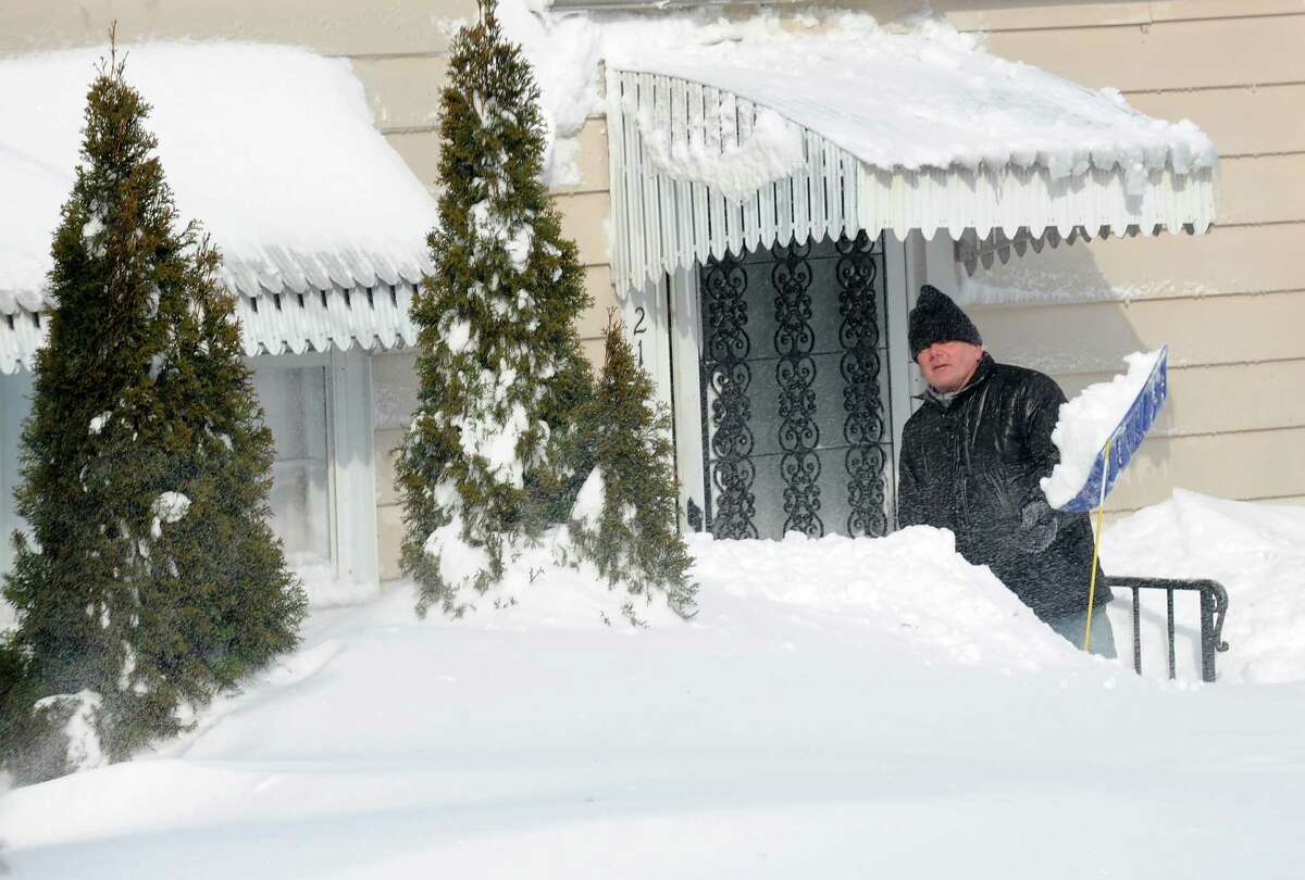 Robbert Button starts to dig out of his Burroughs Rd. home in Fairfield, Conn. on Saturday, Feb. 9, 2013. Southwestern Connecticut was hit by one of the biggest snowstorms in history, a howling blizzard that dumped over two feet of snow across area.