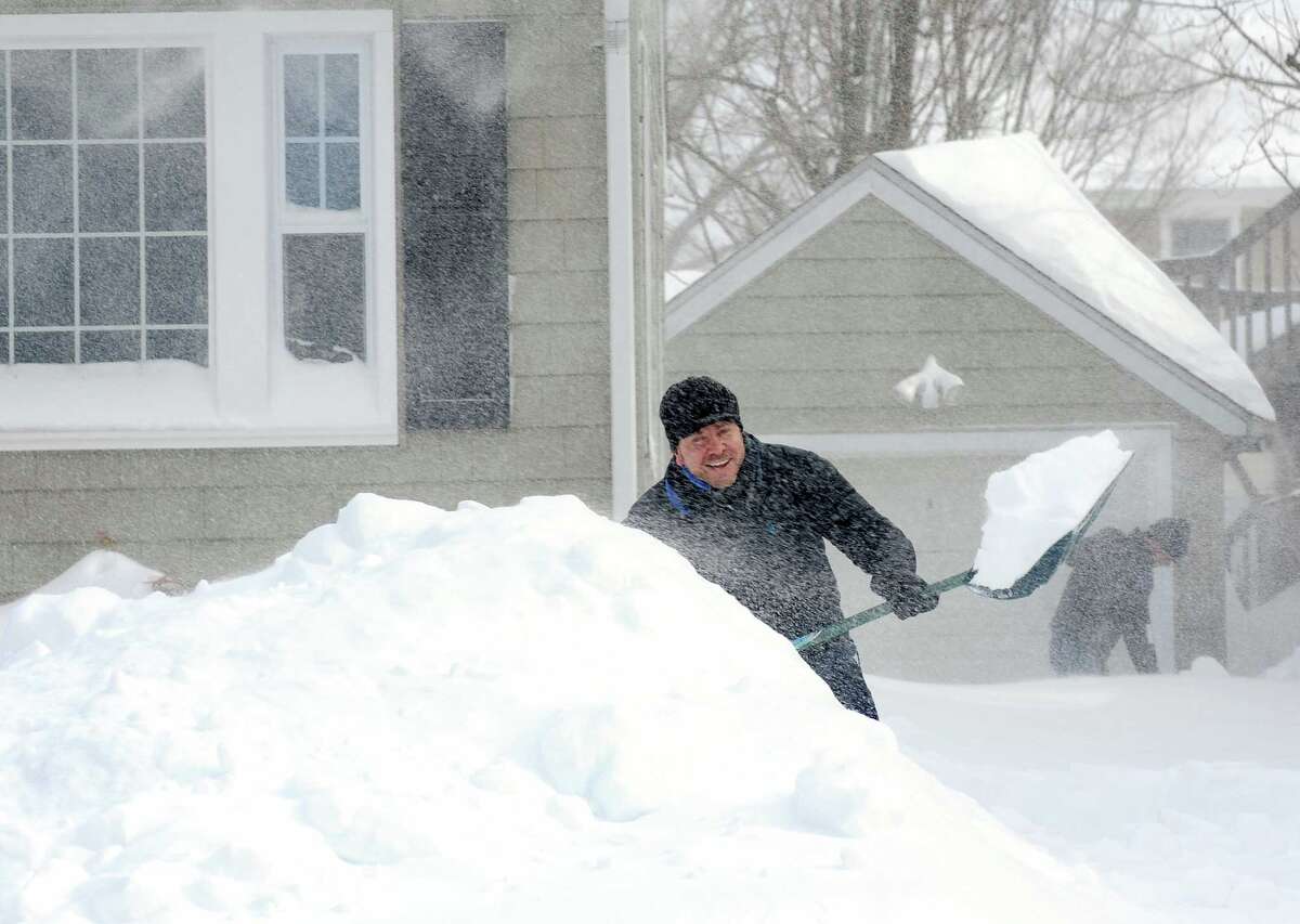 Burroughs Rd. resident Darren Wagner and his friend Bob Nolan dig out after an overnight blizzard dumped over two feet of snow on Fairfield, Conn. on Saturday, Feb. 9, 2013. Southwestern Connecticut was hit by one of the biggest snowstorms in history.