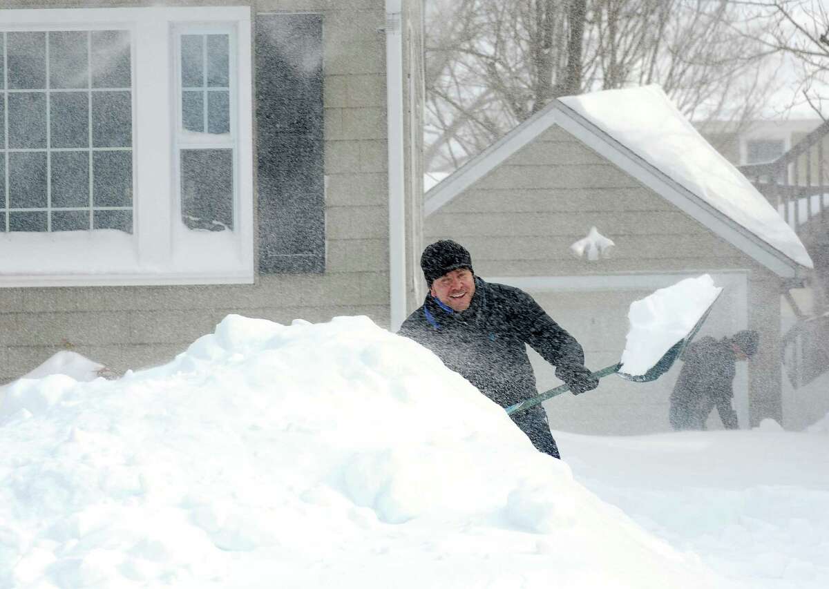 Burroughs Rd. resident Darren Wagner and his friend Bob Nolan dig out after an overnight blizzard dumped over two feet of snow on Fairfield, Conn. on Saturday, Feb. 9, 2013. Southwestern Connecticut was hit by one of the biggest snowstorms in history.