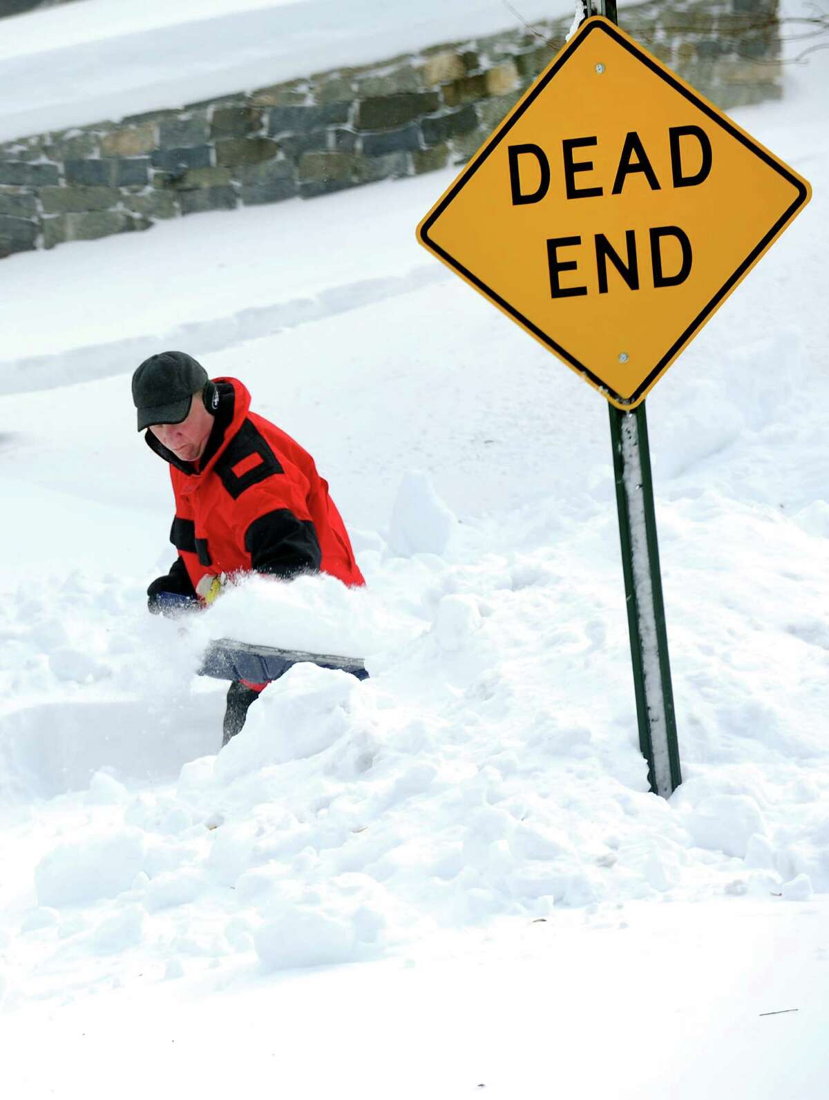Craig Roberts clears his driveway on the corner of Shagbark La. and Katona Dr. in Fairfield, Conn. on Saturday, Feb. 9, 2013. Roberts was one of many residents digging out after a overnight blizzard dumped over two feet of snow on Southwestern Connecticut.
