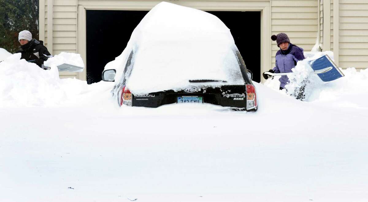Deb Bross and her mom Sue Bross shovel their driveway on Katona Dr. in Fairfield, Conn. on Saturday, Feb. 9, 2013. Southwestern Connecticut was hit by one of the biggest snowstorms in history, a howling blizzard that dumped up to three feet of snow across the state.