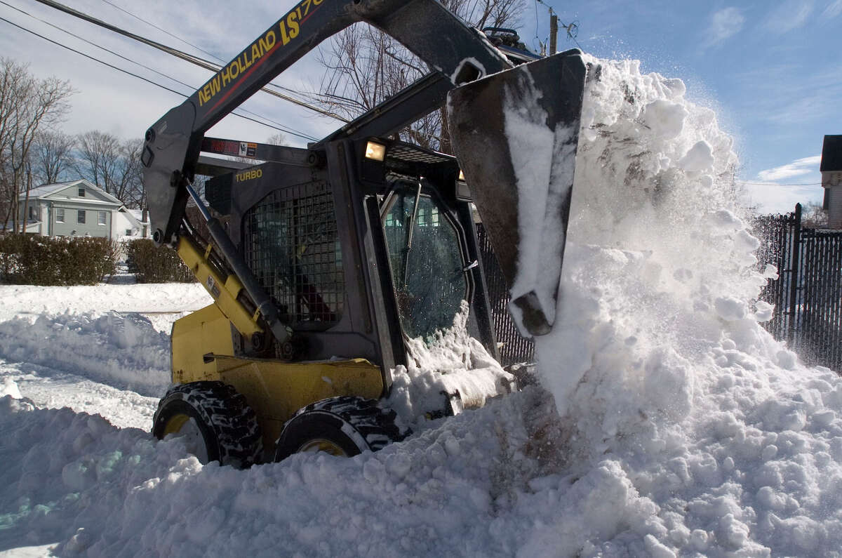 Barry Pritchard clears out snow from the Family & Children's Aid child guidance center parking lot on West Street in Danbury on Saturday, Feb. 9, 2013.