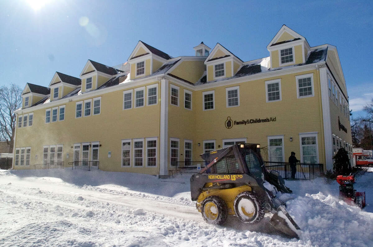 Barry Pritchard clears out snow from the Family & Children's Aid child guidance center parking lot on West Street in Danbury on Saturday, Feb. 9, 2013.