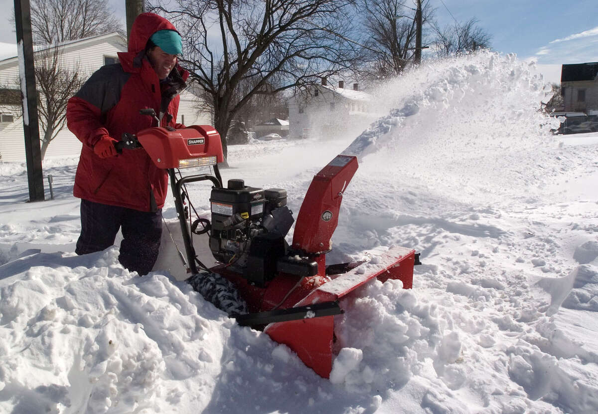 Barry Pritchard clears out snow from the Family & Children's Aid child guidance center parking lot on West Street in Danbury on Saturday, Feb. 9, 2013.