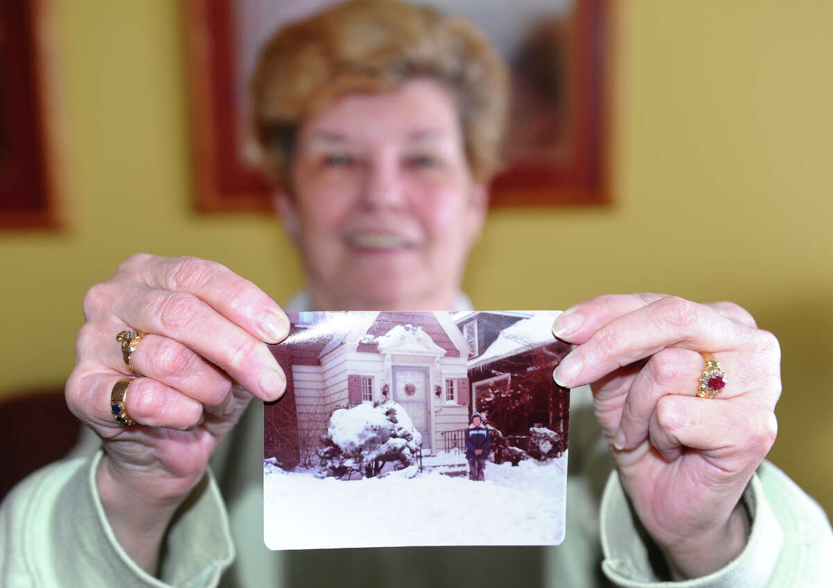 Rosie Kelly shows a picture of herself from the Blizard of 1978 as she enjoys a blizzard party with friends at the Savin Beach Condo complex on Beach Street after a blizzard pounded the region in West Haven, Conn. on Saturday February 9, 2013.