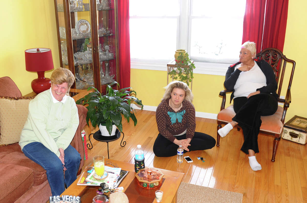 Rosie Kelly, left, Meghan Schillio, center, and her mom Debbie enjoy a blizzard party with friends at the Savin Beach Condo complex on Beach Street after a blizzard pounded the region in West Haven, Conn. on Saturday February 9, 2013.