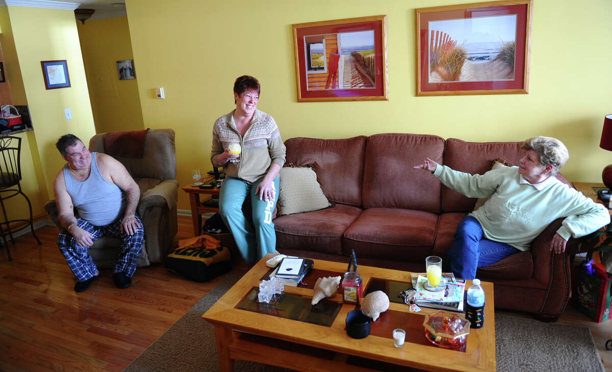Residents Nancy and Lou Tagliatele, left, hold a blizard party at their home with Rosie Kelly, right, and other friends along Beach Street after a blizzard pounded the region in West Haven, Conn. on Saturday February 9, 2013.