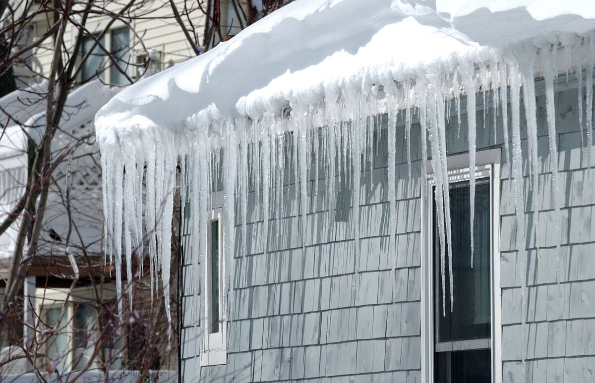 Huge icicles hang down from a house after the blizzard which pounded the region in West Haven, Conn. on Saturday February 9, 2013.