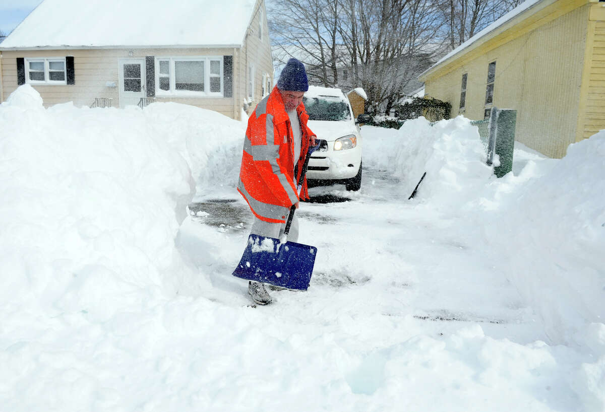 Resdident Ed Valente shovels his driveway after a blizzard pounded the region in West Haven, Conn. on Saturday February 9, 2013.