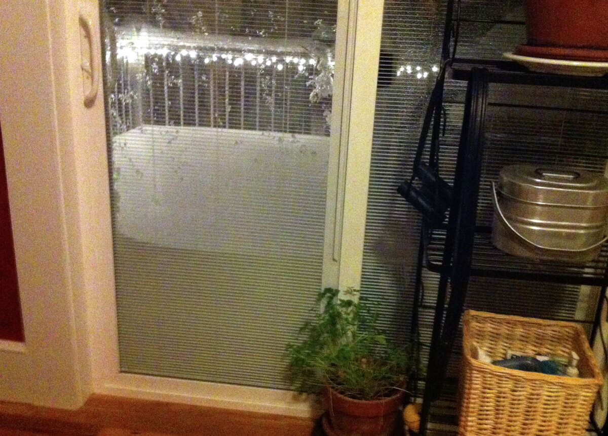 Snow plies up against a glass slider door as a blizzard pounds the region in West Haven, Conn. on Friday February 8, 2013. The snow fall amount the next day on the deck was 27 inches!