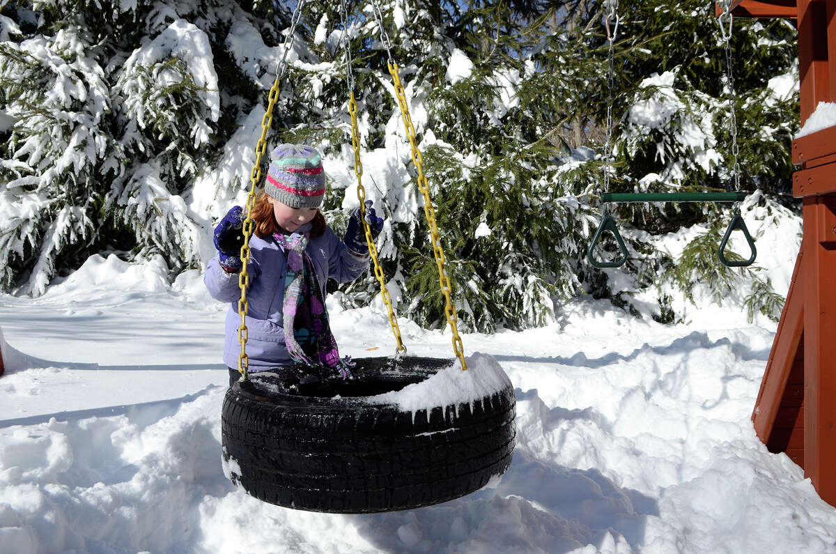 Molly Coccaro, 7, enjoys the snow in her backyard in Southport, CT on Sat., Feb. 9, 2013, following a blizzard that dumped up to three feet of snow across the state.