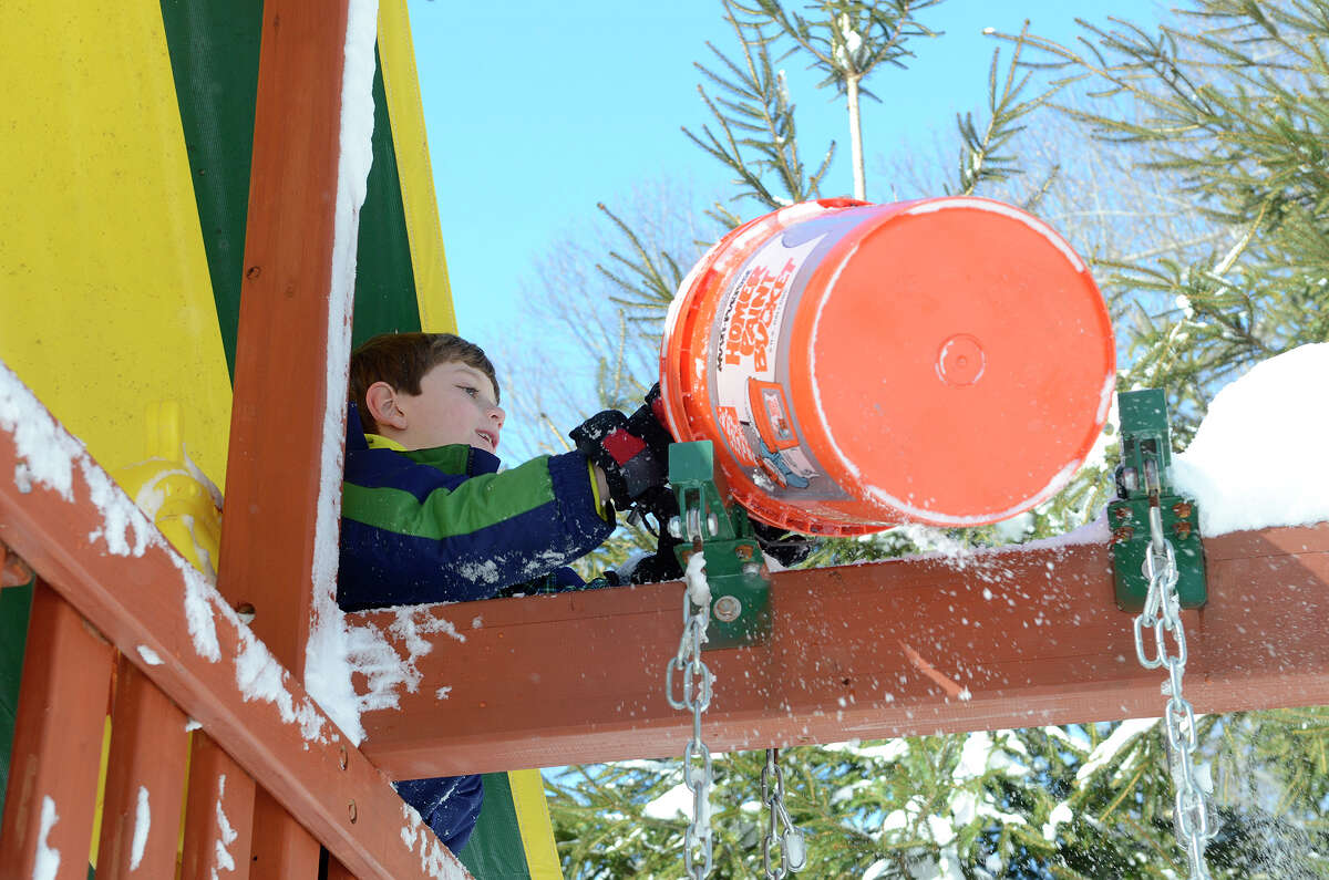 Ryan Tymon, 7, plays in a neighbor's backyard in Southport, CT on Sat., Feb. 9, 2013, following a blizzard that dumped up to three feet of snow across the state.