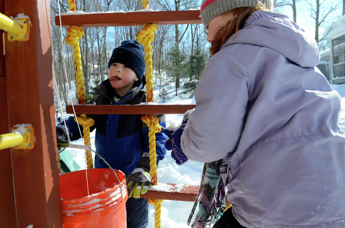 Tommy Coccaro, 5, enjoys a sunny day in his backyard in Southport, CT on Sat., Feb. 9, 2013, following a blizzard that dumped up to three feet of snow across the state.