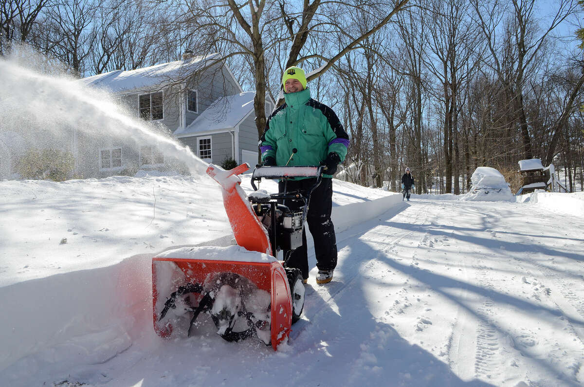 Bret Factora clears his driveway in Southport, CT on Sat., Feb. 9, 2013, following a blizzard that dumped up to three feet of snow across the state.