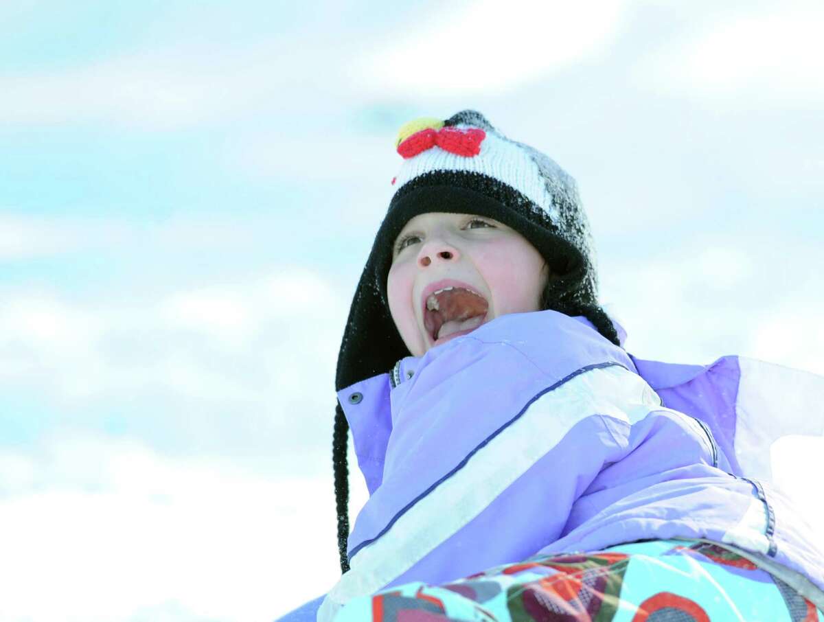 Delila Brien, 11, of Greenwich, screams at the end of a sled ride down a steep hill at the Western Greenwich Civic Center during the aftermath of the blizzard that hit Greenwich, Saturday, Feb. 9, 2013.