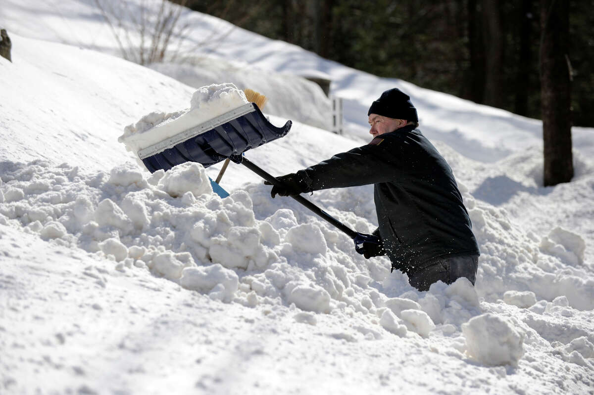 Bob Martin, of Nashville Road in Bethel, digs out after a blizzrd dumped almost two feet of snow in the area Friday and early Saturday morning, Feb. 9, 2013.