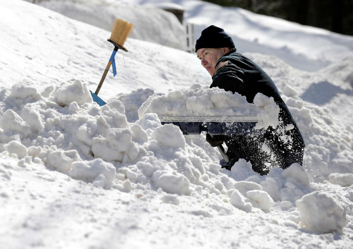 Bob Martin, of Nashville Road in Bethel, digs out after a blizzrd dumped almost two feet of snow in the area Friday and early Saturday morning, Feb. 9, 2013.